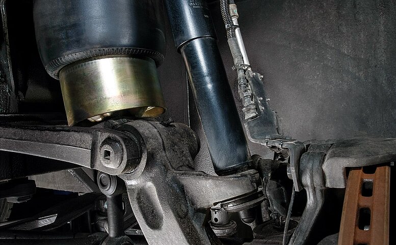 Shock absorbers for trucks and other commercial vehicles